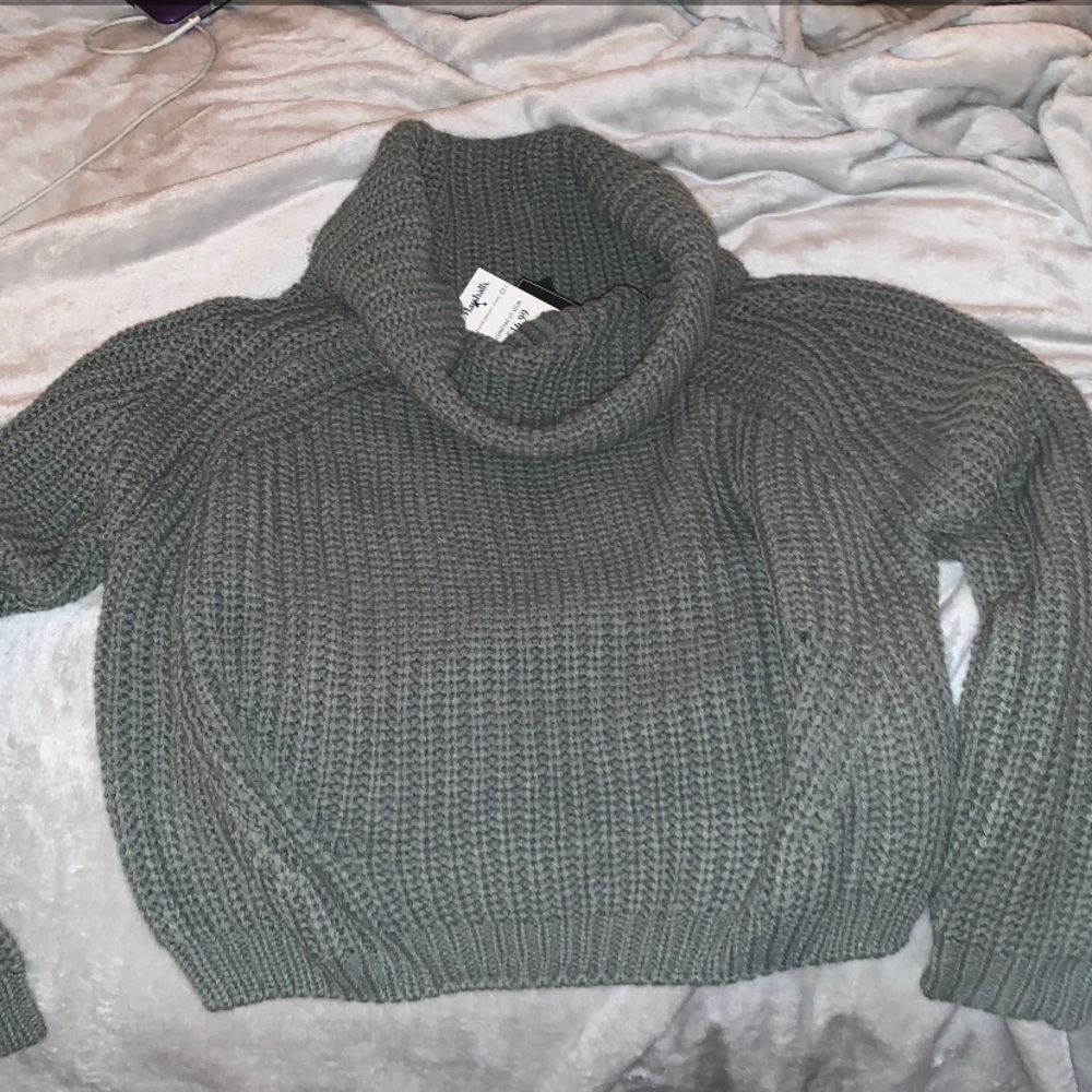 Green turtleneck sweater